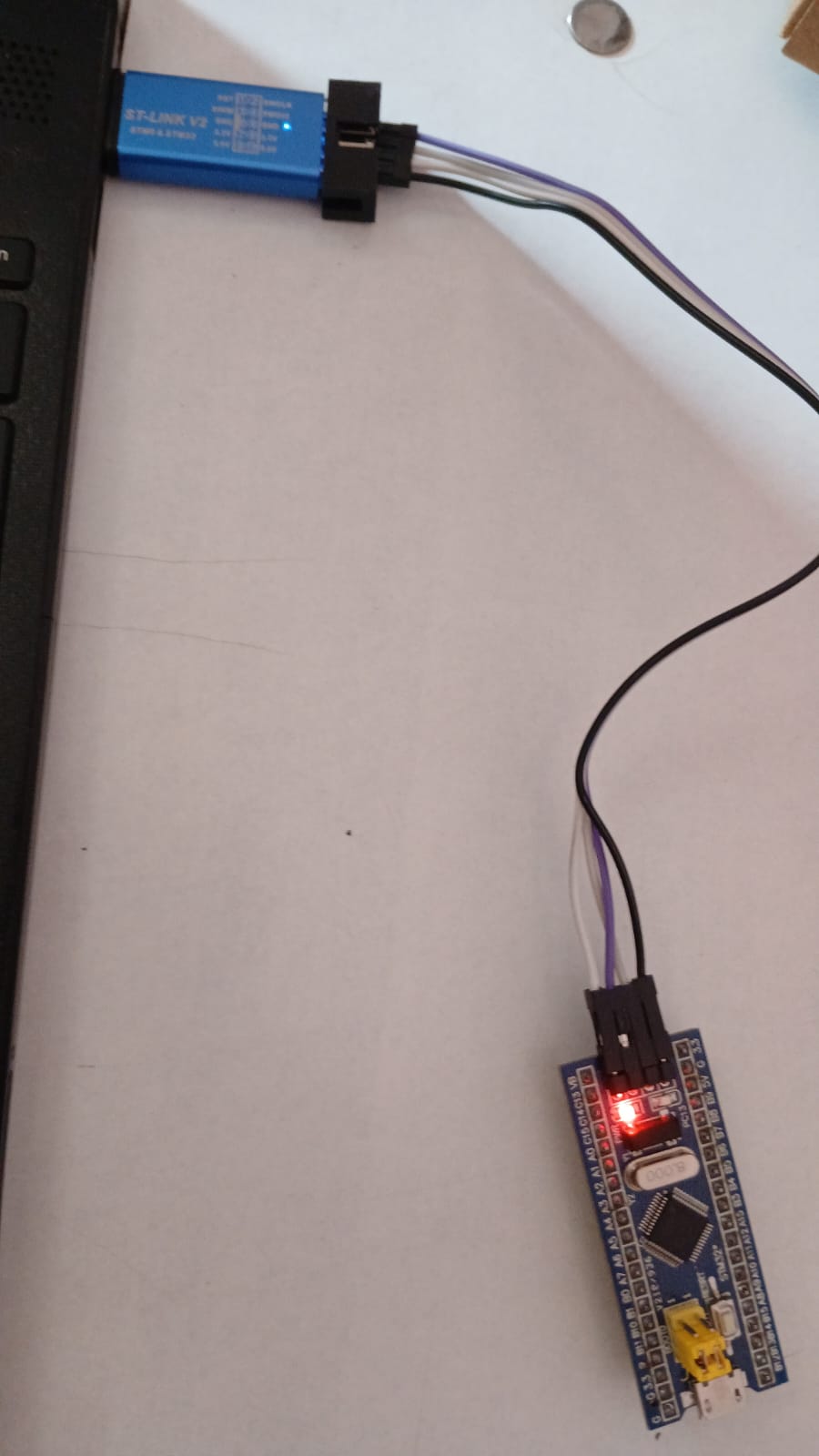STM32F1 Blue Pill development board connected to electronic hardware during an embedded systems workshop